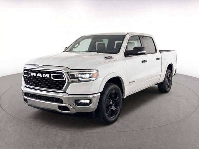2025 RAM 1500 Big Horn Crew Cab 4x4 5'7" Box in White — front three-quarter view