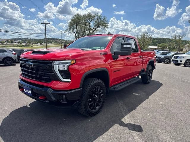 2026 Chevrolet Silverado 2500 HD LT in Red Hot — front three-quarter view