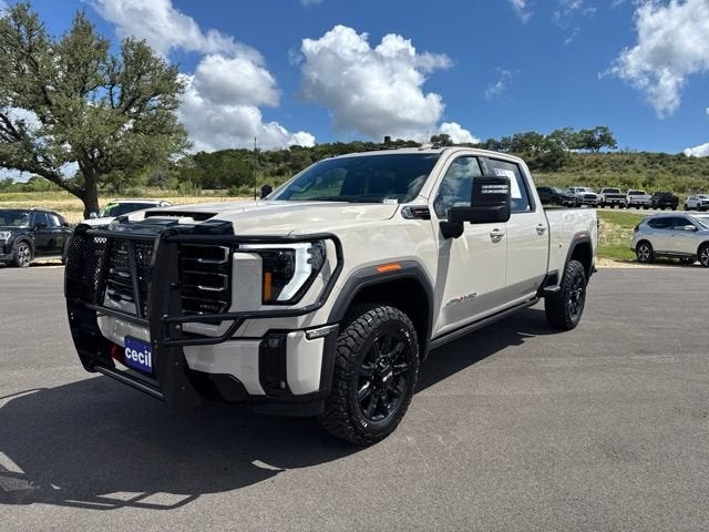 2026 GMC Sierra 2500 HD AT4 in Coastal Dune — front three-quarter view