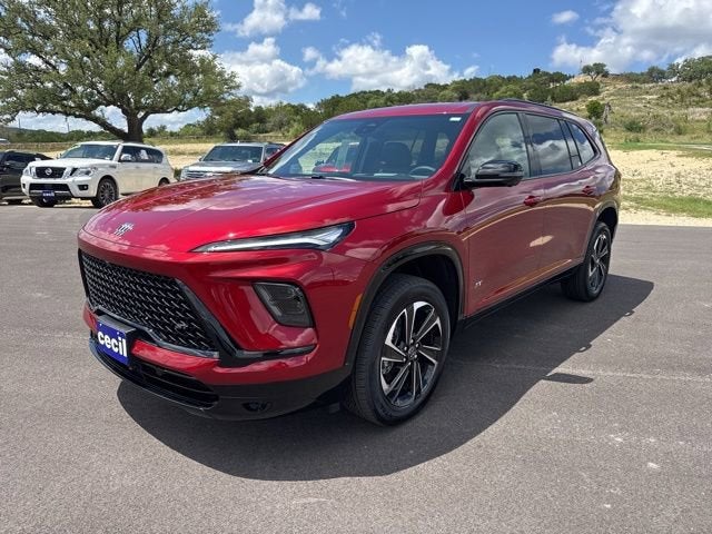 2026 Buick Enclave Sport Touring in Cherry Red Tintcoat — front three-quarter view